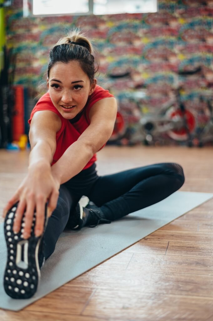 Woman stretching in the gym
